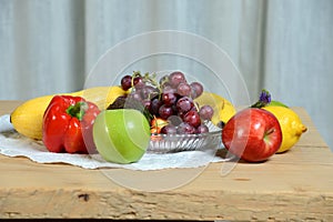 Fruits and Vegetables on Wooden Tab;e