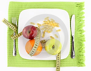 Fruits, vitamins and measuring tape photo