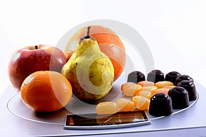 Fruits vs sweets on scale