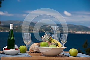 Fruits and wine with view photo