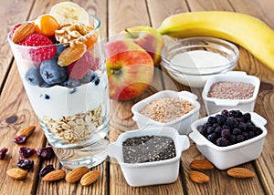 Fruits, yogurt and healthy toppings photo