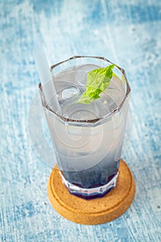 Fruity Bubble Tea in glass cup on blue background