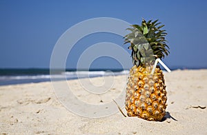 Fruity cocktail on the beach sand