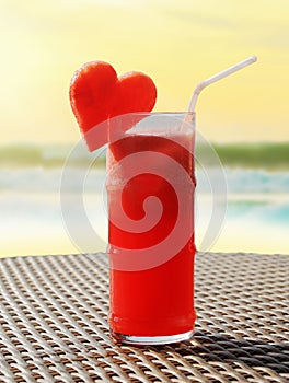 Fruity cocktail on a beach table