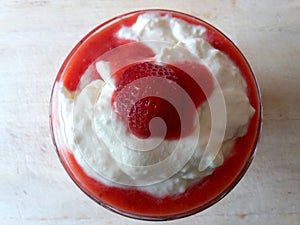 Fruity dessert with strawberries and whipped creme