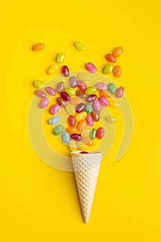 Fruity jellybeans. Tasty colorful jelly beans and waffle cone