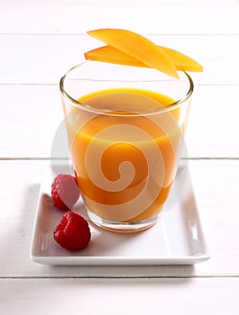 Fruity mango smoothie with raspberry