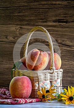 Fruity peaches in a wicker basket