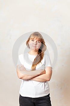 Frustrated 30-year-old girl on  light background