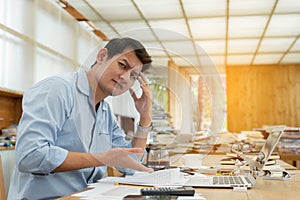 Frustrated Annoyed businessman having problems while working with laptop