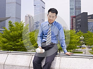 Frustrated asian business executive