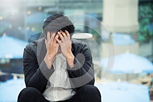 Frustrated Asian Businessman failing photo