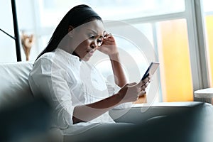 Frustrated Black Woman Having Problems With Smartphone