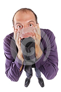 frustrated business man biting necktie