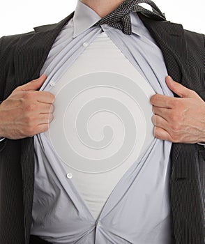 Frustrated business man tearing off his shirt