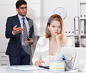 Frustrated business woman with angry chief