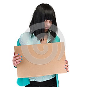 Frustrated business woman showing blank cardboard