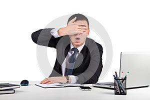 Frustrated businessman close his eyes by hand isolated on white background