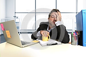 Frustrated businessman desperate face expression suffering stress at office computer desk