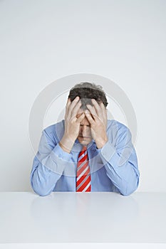 Frustrated Businessman With Hands On Head