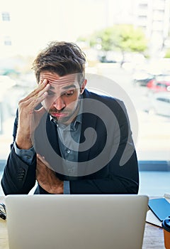 Frustrated, businessman and laptop with debt, mistake or financial crisis for bad news at cafe. Tired man, employee or