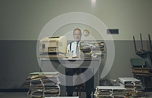 Frustrated businessman overloaded with paperwork