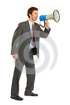 Frustrated businessman yelling through megaphone