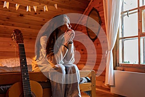 Frustrated confused asian young woman feeling anxious after reading bad news looking away at window