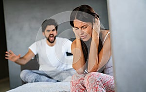 Frustrated couple arguing and having marriage problems. Domestic violence