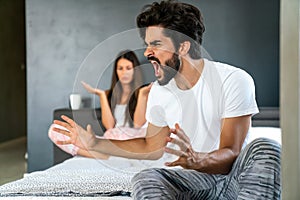 Frustrated couple arguing and having marriage problems. Domestic violence