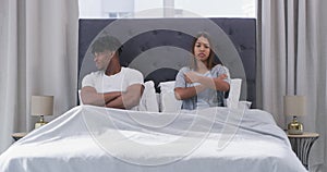 Frustrated couple, bed and argument in conflict, disagreement or divorce from fight at home. Upset man and woman ignore