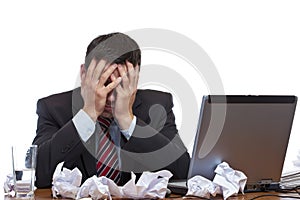 Frustrated desperated man sitting at desk