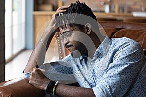 Frustrated disappointed Black guy feeling anger, regret