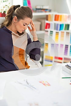 Frustrated fashion designer in office