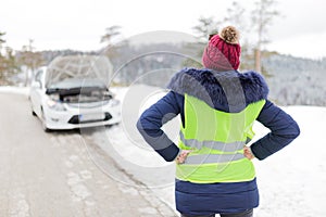 Frustrated female driver. Car breakdown road assistance concept. Winter scene