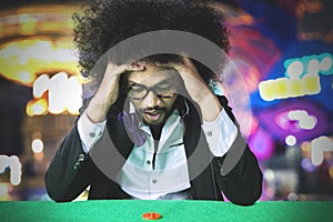 Frustrated gambler man losing on a gamble