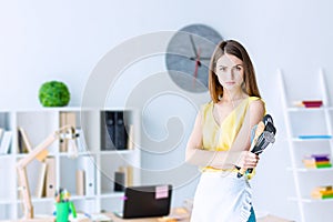 Housewife at office. Gender inequality concept. photo