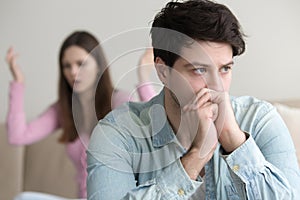 Frustrated husband tired of quarrelling, thoughtful and ignoring