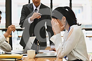 Frustrated intern receiving unfair reprimand rebuke, suffers from bad attitude at work. Emotional pressure and stress at