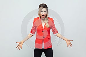 Frustrated irritated angry woman with spread hands, screaming with hate and anger, negative emotions