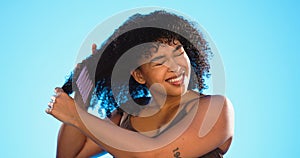 Frustrated, knot and black woman with comb for hair on blue background with problem, hairstyle frizz and damage. Beauty