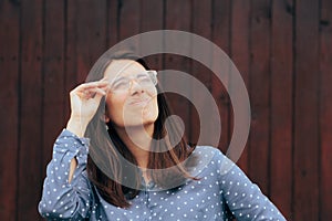 Woman With Foggy Eyeglasses Looking up Squinting