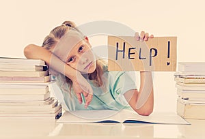 Frustrated little schoolgirl feeling a failure unable to concentrate in reading and writing difficulties learning problem