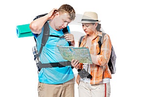 Frustrated lost tourists with map isolated on white