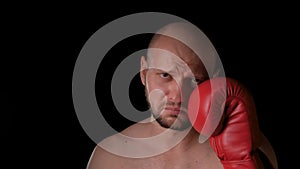 Frustrated male boxer touches his bruised after a knockout. Defeat, loosing