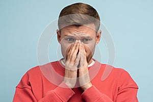 Frustrated man covered face with hands. Grief, sorrow, loss, collapse, distress concept