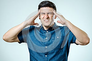 Frustrated man with headache isolated