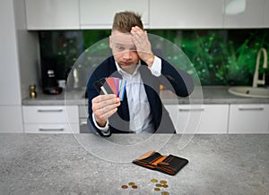 Frustrated man in heavy credit card debt photo