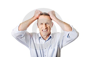 Frustrated man pulling his hair