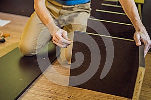 Frustrated Man Putting Together Self Assembly Furniture